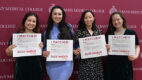 Group of medical students displaying their residency Match Day cards.