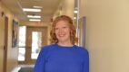 Portrait of HIV specialist Dr. Alexandra Abrams-Downey in a hallway at the outpatient HIV clinic