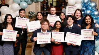 Group of medical students holding their residency match cards during Albany Medical College's 2026 Match Day event.