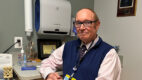 Endocrinologist Dr. Robert Busch sitting in a patient exam room