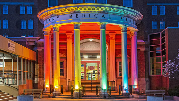 Albany Medical Center pillars lit in rainbow colors