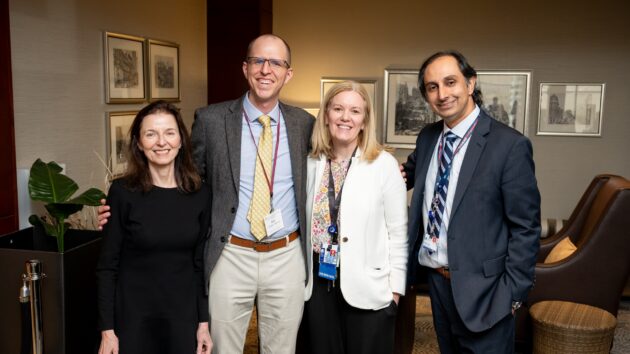 A group of four people gathering at their class reunion.