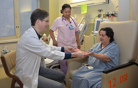 Left: stroke specialist Dr. Colum Amory, Isabel Castro, RN, and stroke patient Carol Coluccio