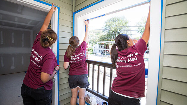 First year medical students work with Habitat for Humanity in Albany's Sheridan Hollow.